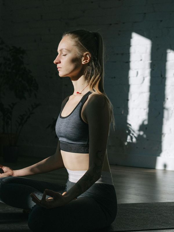 Woman focusing on inner balance and calm breathing